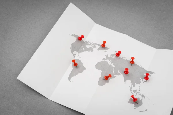 Paper folded world map  with red Pin Pointer . — Stock Photo, Image