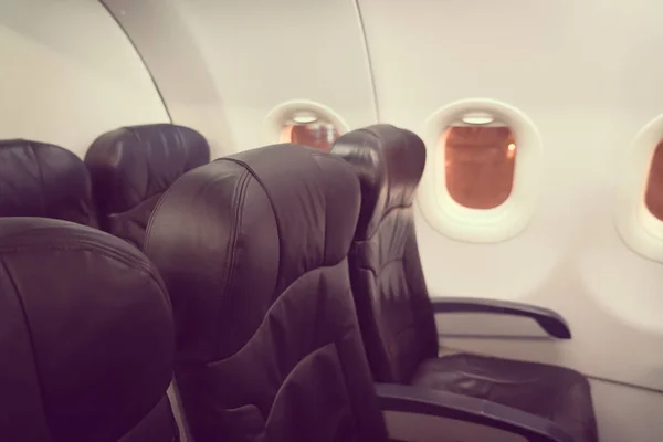 Airplane seats in the cabin ( Filtered image processed vintage e — Stock Photo, Image
