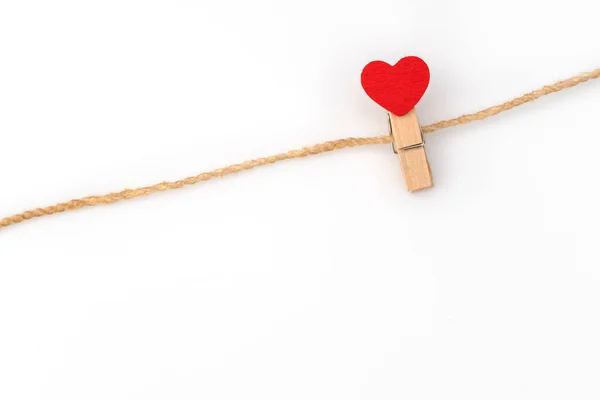 Red paper heart hanging on white background . — Stock Photo, Image