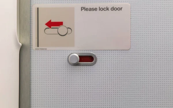 Airplane lavatory lock door . — Stock Photo, Image