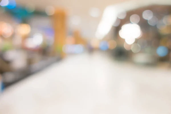 Abstracto desenfoque de la gente en el centro comercial  . — Foto de Stock