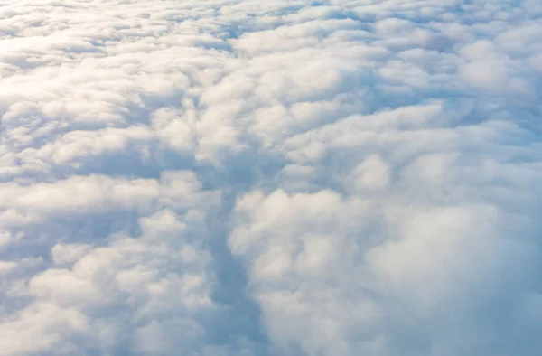 Sunrise above clouds from airplane window . — Stock Photo, Image