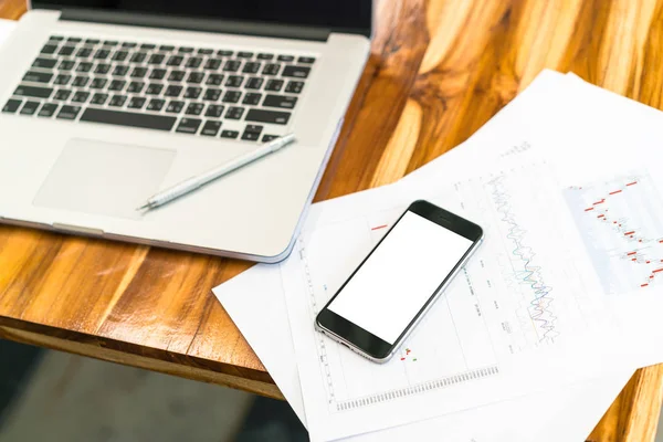 Financial charts on the table with laptop . — Stock Photo, Image