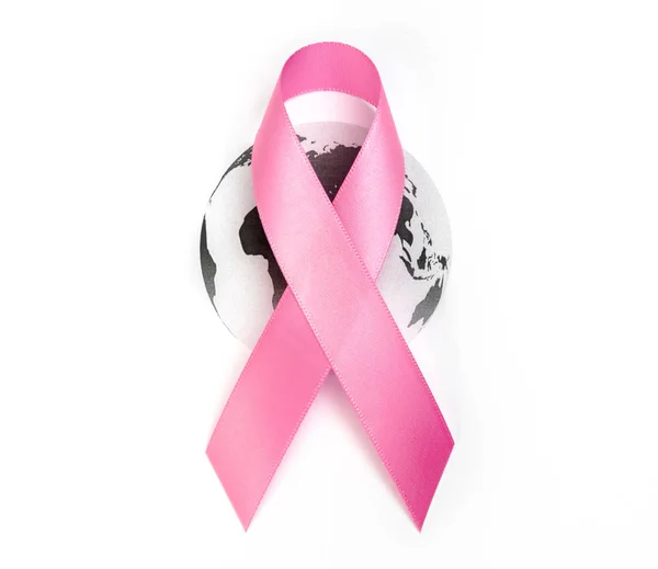 World cancer day : Breast Cancer Awareness Ribbon on world map . — Stock Photo, Image