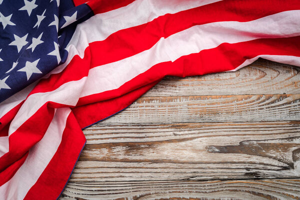 American flag on wood background .