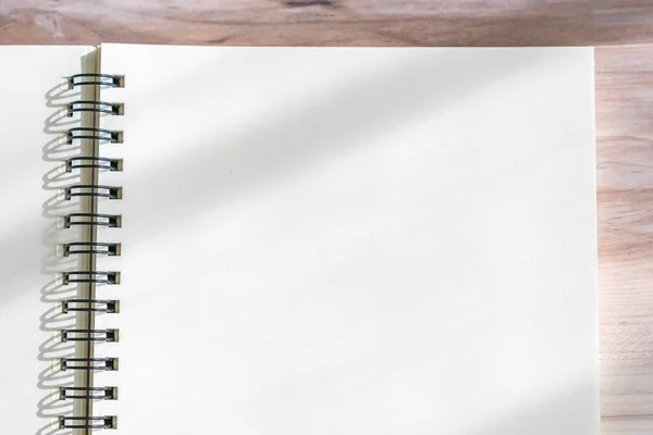 Blank notebook mock up on wood background — Stock Photo, Image