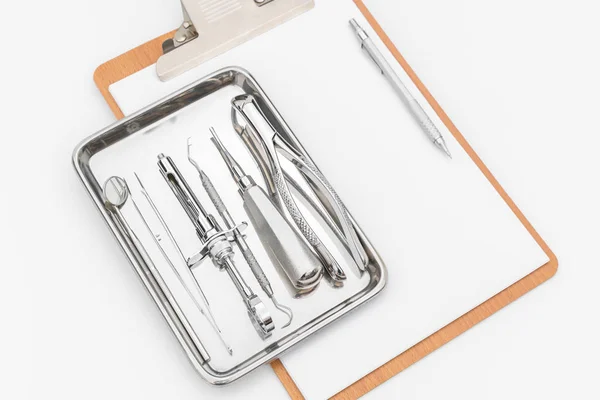 Dental tools, equipment and dental chart on white background — Stock Photo, Image