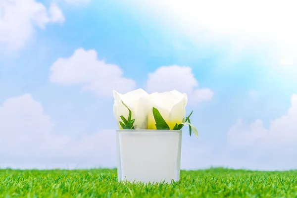 Beautiful of artificial flowers on grass — Stock Photo, Image