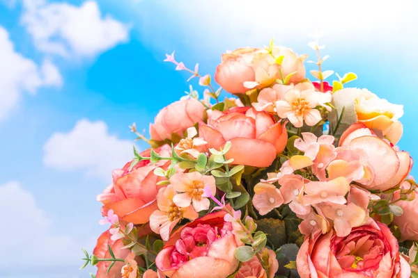 Beautiful of artificial flowers over blue sky — Stock Photo, Image