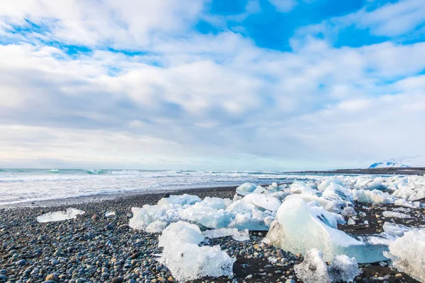 Ice cube breaking on black rock beach , Iceland winter season la — Stock Photo, Image