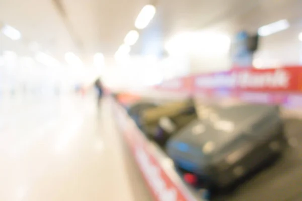 Abstract blur of Suitcase on luggage conveyor belt . — Stock Photo, Image