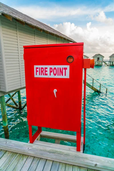 Fire point sign at Beautiful water villas in tropical Maldives i — Stock Photo, Image