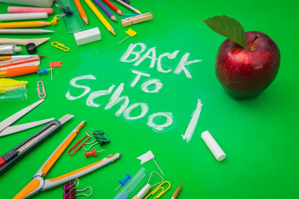 School supplies on Green chalkboard " Back to school background — Stock Photo, Image