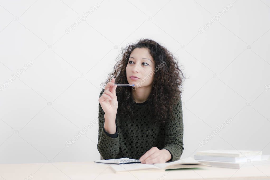 Young latin woman studying