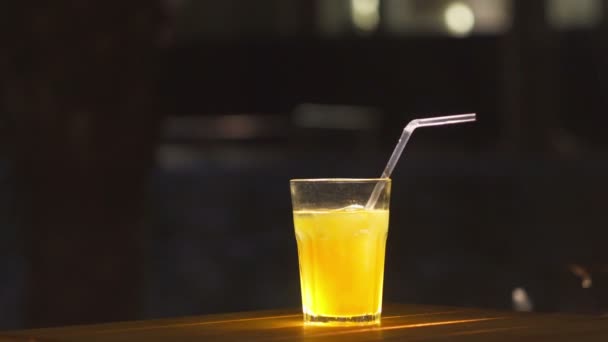 Ice coctail closeup. Rum alcohol and mango juice. — Stock Video