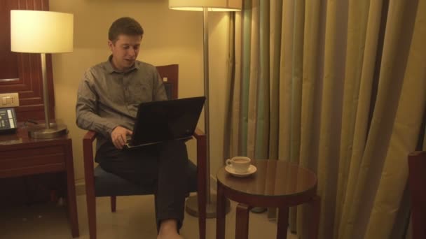 Man using laptop and has conversation via skype. — Stock Video