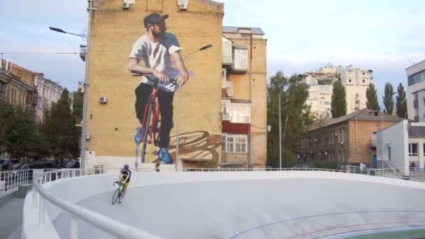 Cyclists are training on a professional velodrome outdoor. 15.09.2017 Ukraine, Kyiv — Stock Video