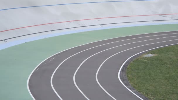 Cyclists are training on a professional velodrome outdoor. 15.09.2017 Ukraine, Kyiv — Stock Video
