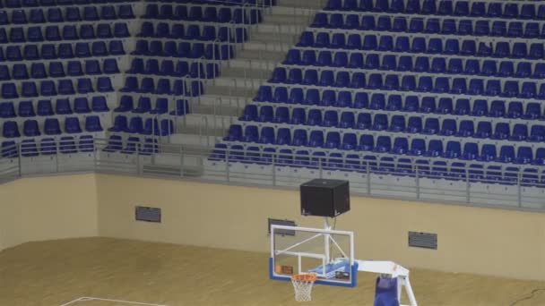 Background of empty seats and basketball hoop in a basketball arena — Stock Video