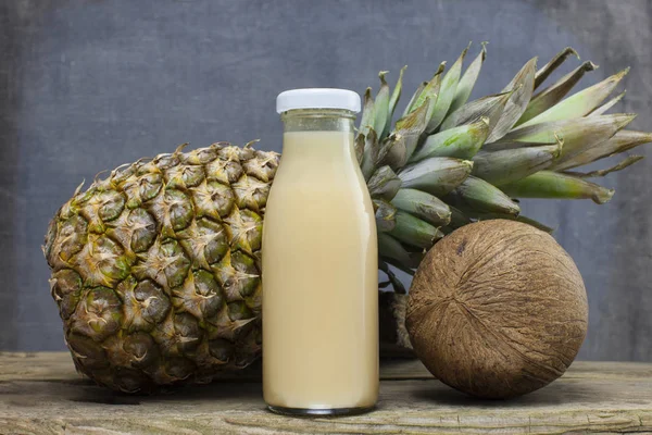 Juice bottle on vintage wooden background