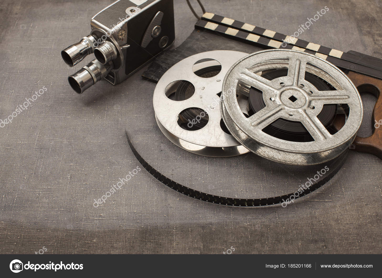Old movie camera, film reels and clapperboards — Stock Photo © spartakas1  #185201166