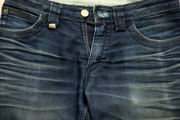 Ziemlich alte blaue Jeans haben Streifen und Reißverschluss Texturen — Stockfoto