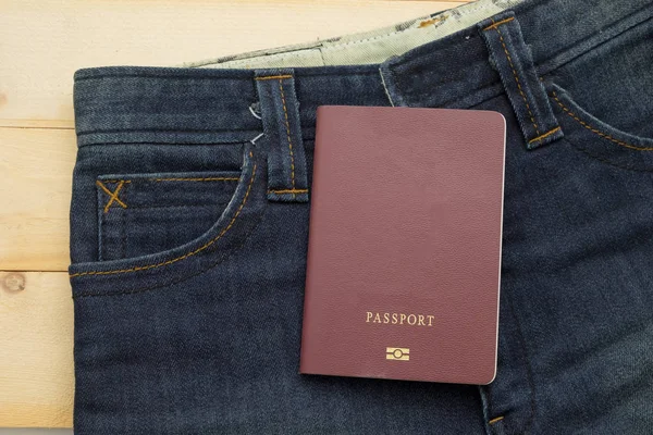 Passport put on rather old blue jean — стоковое фото