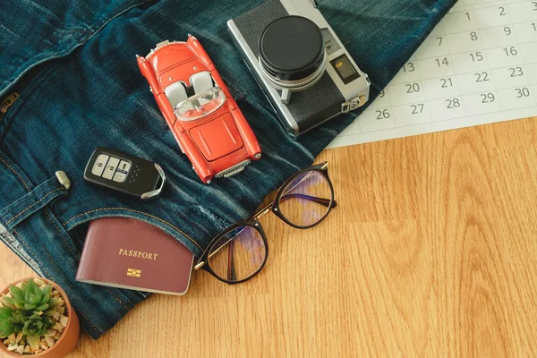 top view. passport book insert on pocket jean pants with glasses