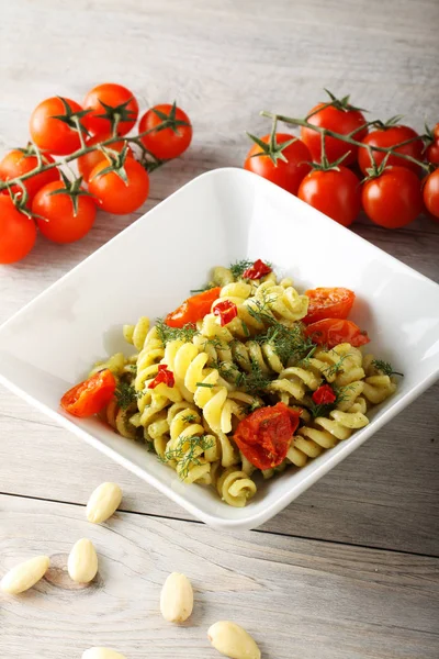 Pasta with fennel pesto, almonds and cherry tomatoes — Stock Photo, Image