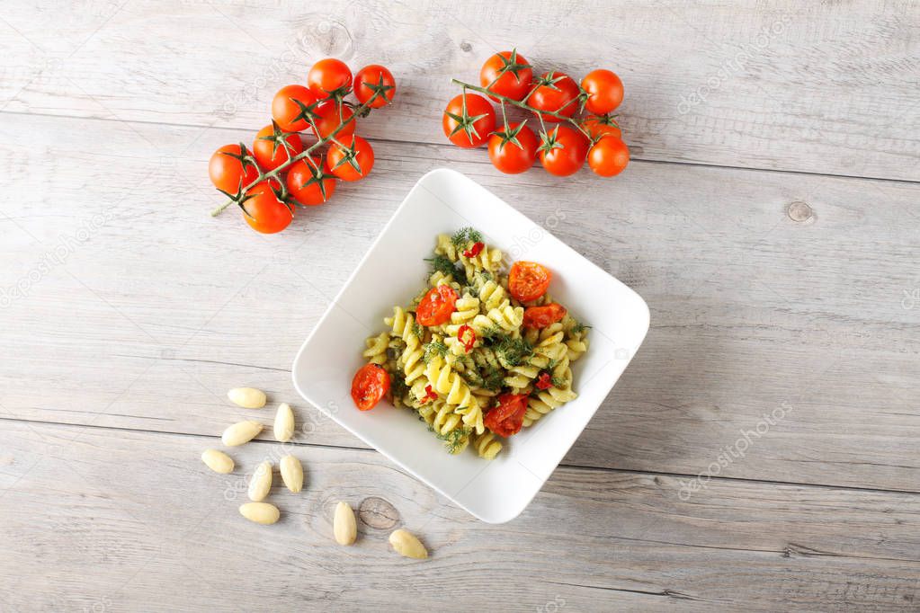 Pasta with fennel pesto, almonds and cherry tomatoes