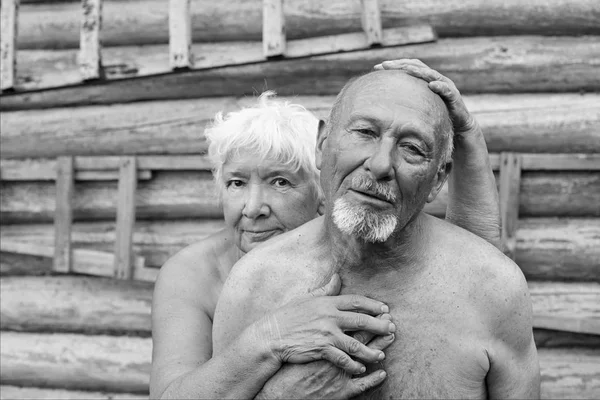 Authentic black and white portrait of funny ridiculous old couple of