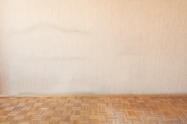 Old wooden floor in empty room interior with dusty tapestry — Stock Photo, Image