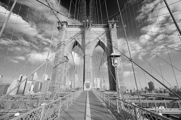 Empty Brooklyn Bridge view in a sunny day, New York in black and white