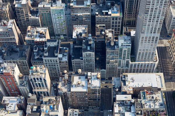 New York City Manhattan aerial view with buildings roof tops and streets in a sunny day