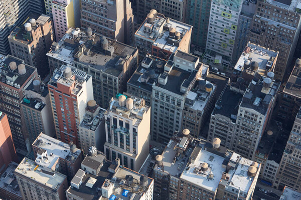 New York City Manhattan aerial view with buildings roof tops and streets in the morning