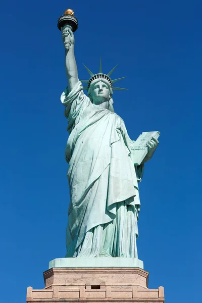 Statue of Liberty with pedestal front view in a sunny day, blue sky in New York — Stock Photo, Image