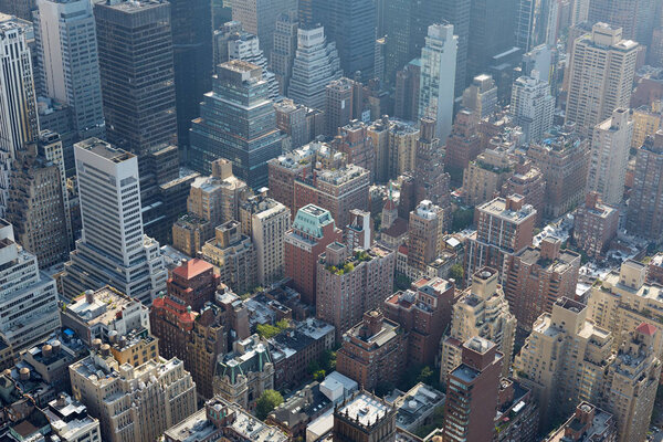 New York City aerial view with skyscrapers, sunlight and mist from above