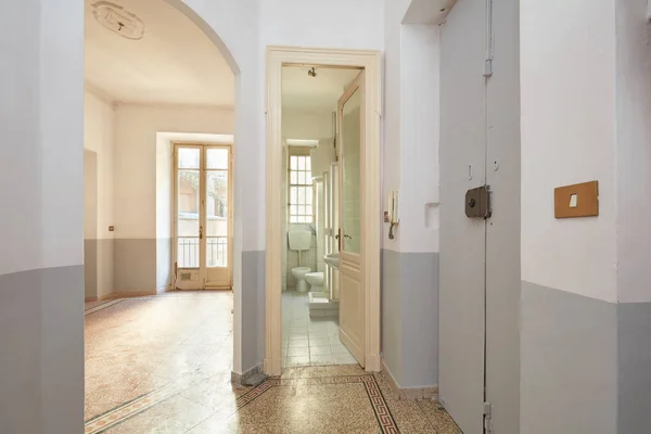 Old apartment interior with bathroom and living room in Europe