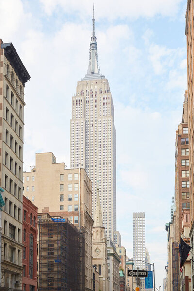 NEW YORK - SEPTEMBER 10: Empire State Building seen from Fifth Avenue with buildings on September 10, 2016 in New York. From 1931 was the tallest world's building for 40 years.