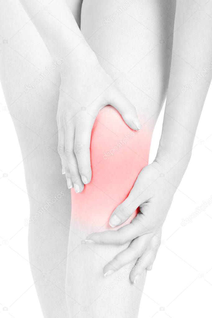Young woman knee close up red area with hands isolated on white, clipping path