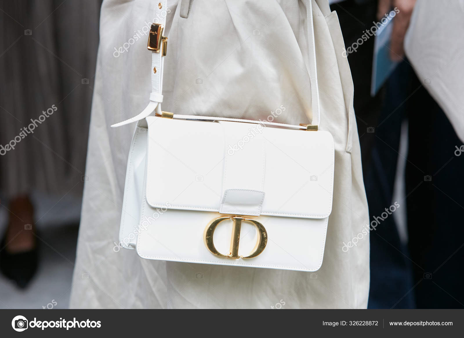 Woman with Louis Vuitton Bag with Golden Chain and White Jacket before  Emporio Armani Fashion Editorial Image - Image of golden, chain: 194222960