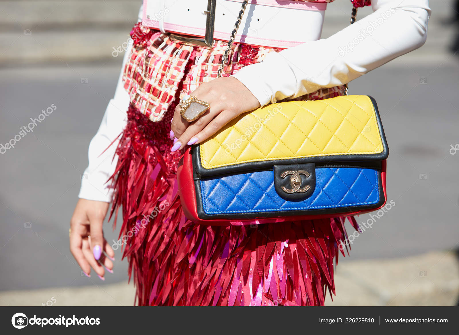 Woman with yellow, blue and red Chanel bag before Genny fashion show, Milan  Fashion Week street style – Stock Editorial Photo © AndreaA. #326229810