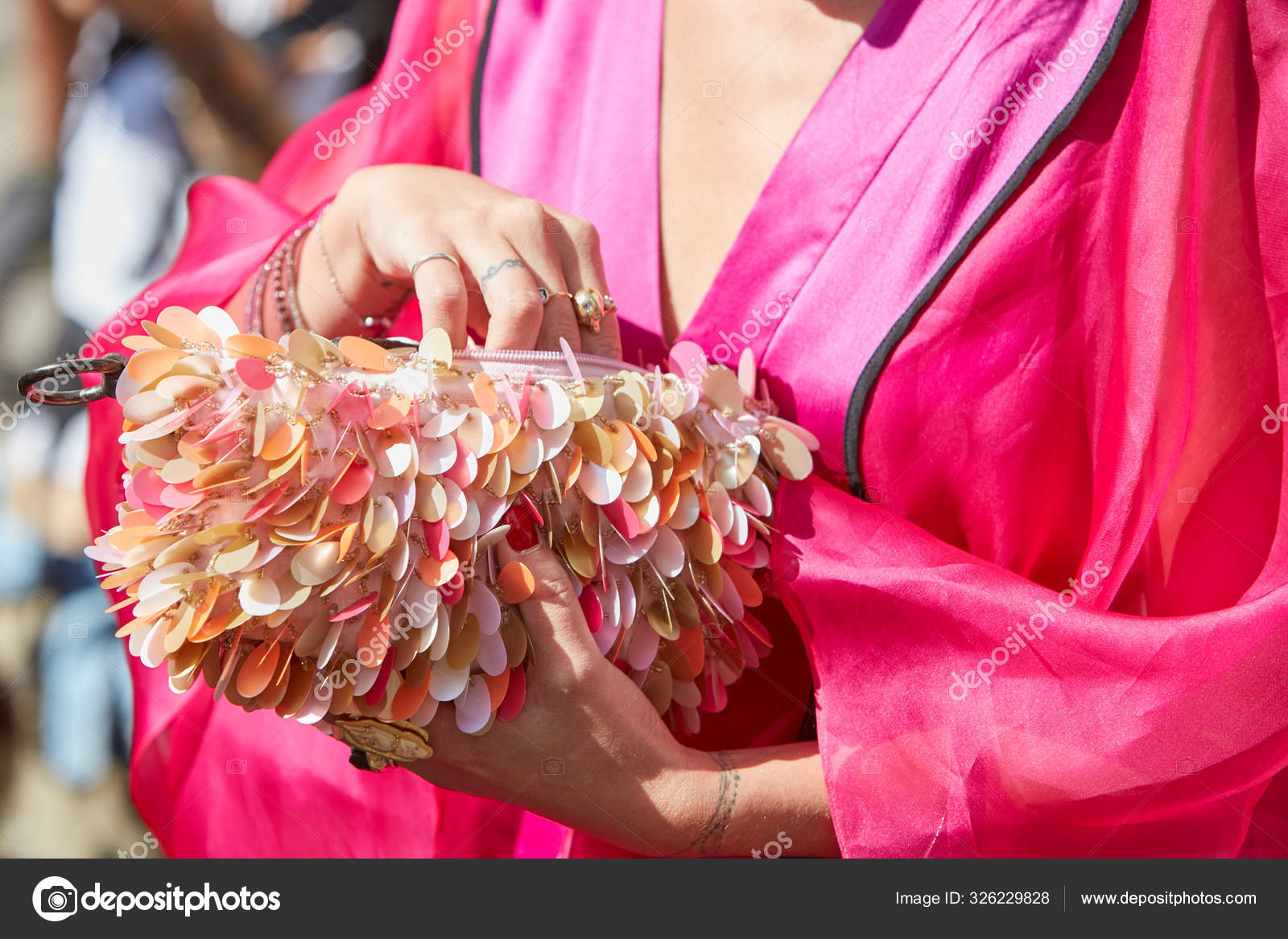 Woman With Pink Jacket And Bag With White Yellow And Orange