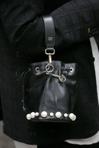 Woman with black leather Fendi bag with pearls decoration before Emporio Armani fashion show, Milan Fashion Week street style — Stock Photo, Image