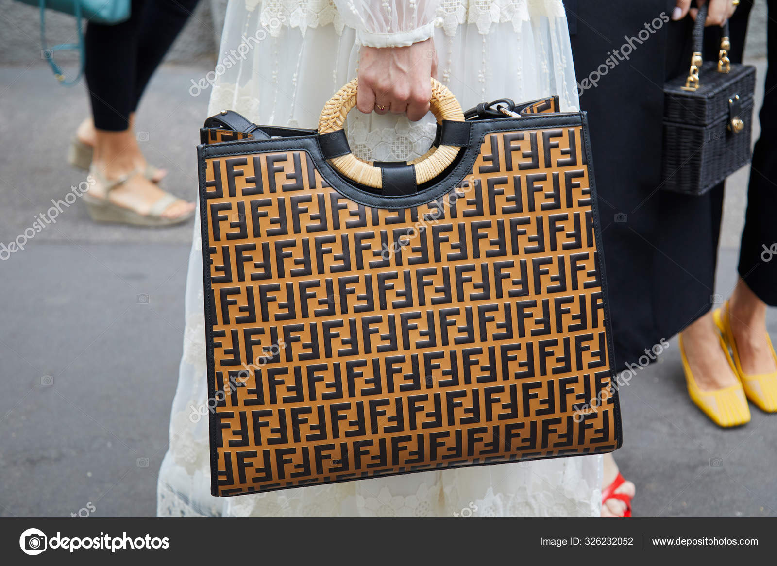 Woman with brown Fendi bag with wicker handle before Fendi fashion show,  Milan Fashion Week street style – Stock Editorial Photo © AndreaA.  #326232052