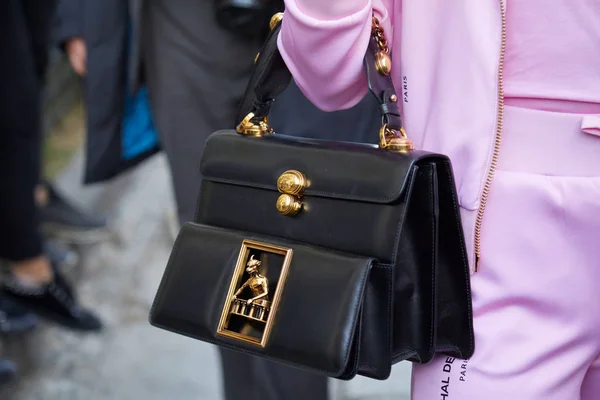 MILAN, ITALY - SEPTEMBER 18, 2019: Woman with Louis Vuitton black patent  leather bag before Prada fashion show, Milan Fashion Week street style  Stock Photo - Alamy