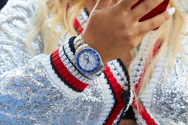 Woman with Rolex Yacht Master and silver sweater before Ermanno Scervino fashion show, Milan Fashion Week street style — стокове фото