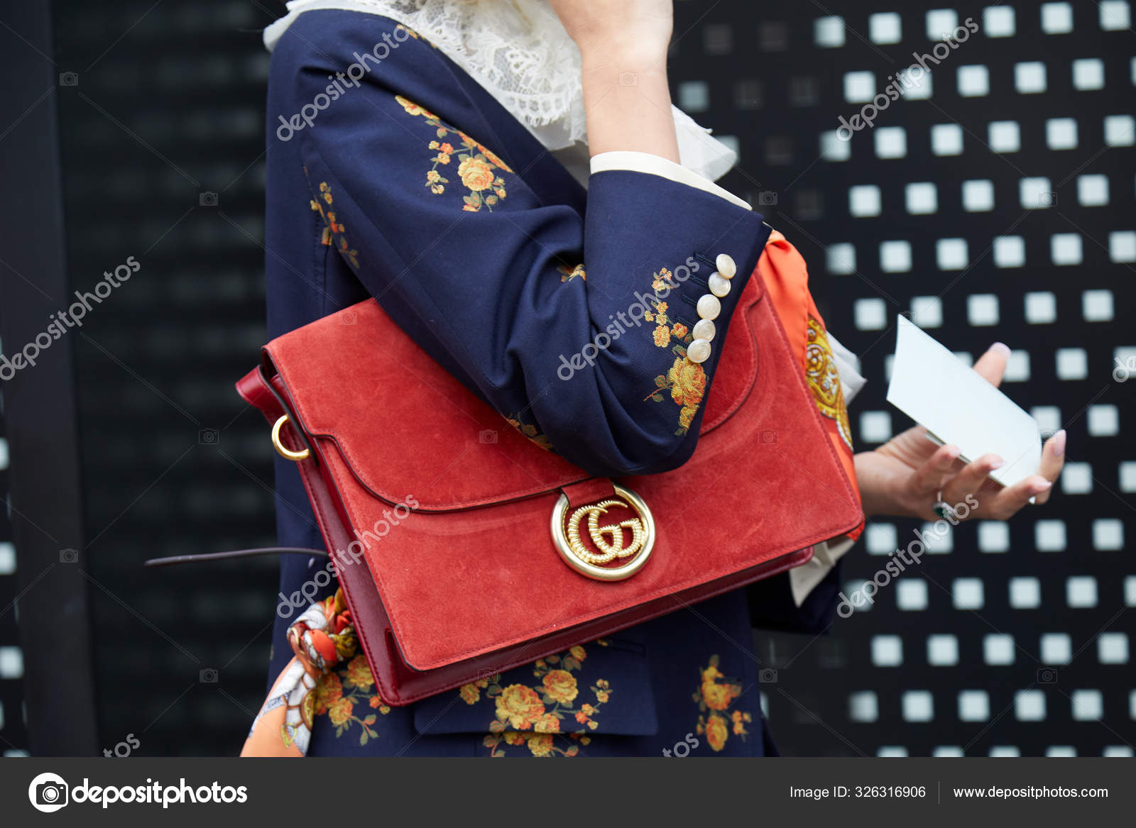 Woman with red Gucci suede bag with golden logo and blue jacket with floral design before fashion show, Milan Fashion Week street style – Stock Editorial Photo © #326316906