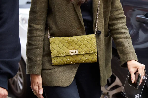 MILAN, ITALY - SEPTEMBER 20, 2019: Woman with brown Louis Vuitton checkered  bag, white dress and Dior bracelets before Sportmax fashion show, Milan Fa  Stock Photo - Alamy