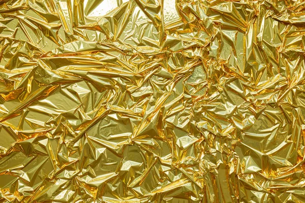 Golden metallic paper, wrinkled texture background — Stock Photo, Image